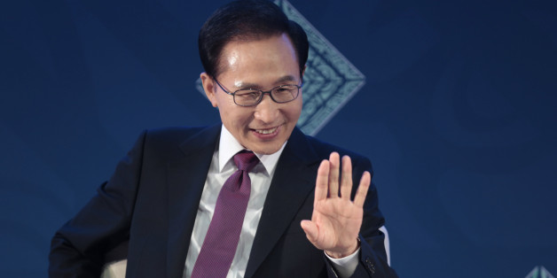 South Koreaâs President Lee Myung-bak waves as he participates in a panel during a B20 meeting prior to the G20 Summit in Los Cabos, Mexico, Monday, June 18, 2012. (AP Photo/Esteban Felix)