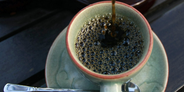 In this photo taken Dec. 3, 2012, the $1,100 per kilogram ($500 per pound) Black Ivory coffee is poured into a cup at a hotel restaurant in Chiang Rai province, northern Thailand. A Canadian entrepreneur with a background in civet coffee has teamed up with a herd of 20 elephants, gourmet roasters and one of the country's top hotels to produce the Black Ivory, a new blend from the hills of northern Thailand and the excrement of elephants which ranks among the world's most expensive cups of coffee. (AP Photo/Apichart Weerawong)