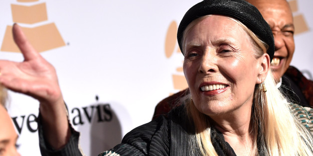 In this Feb.7, 2015 file photo, Joni Mitchell arrives at the 2015 Clive Davis Pre-Grammy Gala at the Beverly Hilton Hotel in Beverly Hills, Calif. Mitchell was hospitalized in Los Angeles on Tuesday, March 31, 2015 according to the Twitter account and website of the folk singer and Rock and Roll Hall of Famer, but details on her condition have not been released. (Photo by John Shearer/Invision/AP, File)
