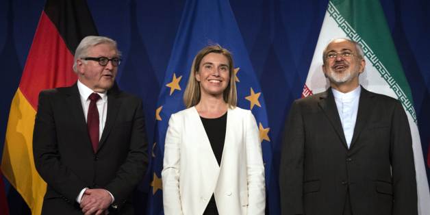 Iranian Foreign Minister Javad Zarif, right, waits to make a statement flanked by German Foreign Minister Frank Walter Steinmeier, left and European Union High Representative for Foreign Affairs and Security Policy Federica Mogherini, at the Swiss Federal Institute of Technology, or Ecole Polytechnique Federale De Lausanne, in Lausanne, Switzerland, Thursday, April 2, 2015, after Iran nuclear program talks finished with extended sessions. The United States, Iran and five other world powers on