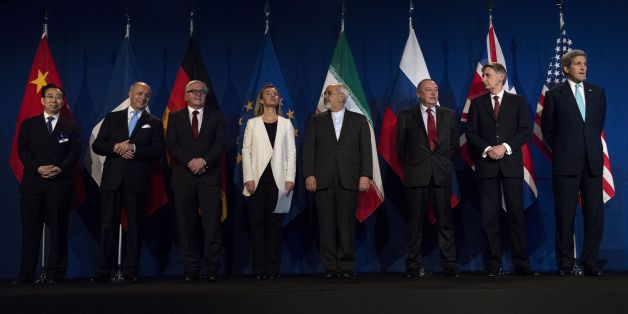 From left, Head of Mission of People's Republic of China to the European Union Hailong Wu, French Foreign Minister Laurent Fabius, German Foreign Minister Frank Walter Steinmeier, European Union High Representative for Foreign Affairs and Security Policy Federica Mogherini, Iranian Foreign Minister Javad Zarifat, an unidentified Russian official, British Foreign Secretary Philip Hammond and US Secretary of State John Kerry arrive, at the Swiss Federal Institute of Technology, or Ecole Polytechn