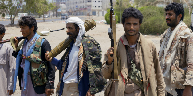 Shiite fighters known as Houthi gather at a street in Aden, Yemen, Thursday, April 2, 2016. Yemen's Shiite rebels and their allies fought their way through the commercial center of Aden on Thursday and seized the presidential palace on a strategic hilltop in this southern coastal city, security officials said. (AP Photo/Wael Qubady)