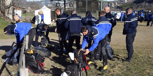French gendarmes get ready to go to the crash site of the German Airbus A320 of the low-cost carrier Germanwings as part of the search operations, on April 2, 2015 in Seyne-les-Alpes. AFP PHOTO / PASCAL GUYOT (Photo credit should read PASCAL GUYOT/AFP/Getty Images)