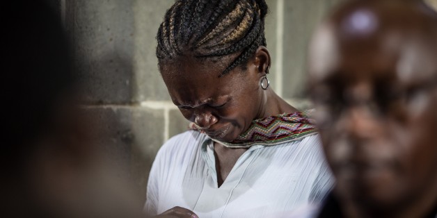 Worshippers gather for an Easter service at the All Saints' Cathedral in Nairobi on April 5, 2015, mourning the country's worst ever massacres, the killing of almost 150 people in an attack on a university by Somalia's Shebab Islamists on April 2, in the northeastern town of Garissa. Kenyans prayed for unity at the start of three days of national mourning for the people murdered in a university massacre. AFP PHOTO /NICHOLE SOBECKI (Photo credit should read Nichole Sobecki/AFP/Getty Images)