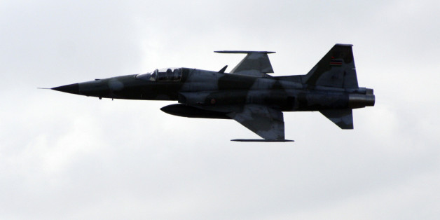 An F5 Jet fighter takes to the sky from Mombasa's Moi International Airport Monday, Dec. 15, 2008, which will join surveillance duties to combat pirates. Kenya's military held a press conference at the Moi International Airport Monday, Dec. 15, 2008, briefing the media over their surveillance of pirates along the Kenyan Coastal line and waters to the South of Somali. The military command announced that Kenyan Air Force jet fighters will be used along with Navy warships to patrol against pirates who persist in hijacking cargo ships along the Somali coastline. (AP Photo)