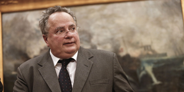 Greece's New Foreign Minister Nikos Kotzias arrives at his new office during a handover ceremony in Athens, Tuesday, Jan. 27, 2015. Greece's new left-wing Prime Minister Alexis Tsipras picked the outspoken bailout critic as his new finance minister Tuesday, signaling his revolve to take a tough line with eurozone lenders in an effort to write off a massive chunk rescue debt. (AP Photo/Petros Giannakouris)