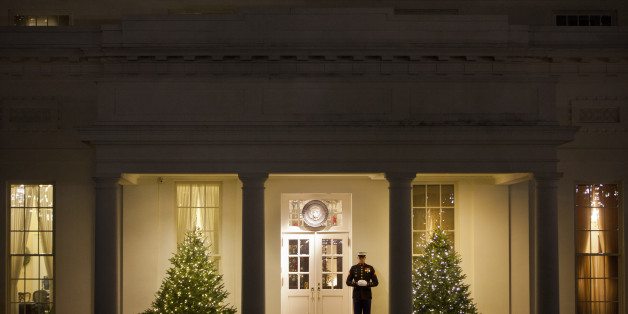 US Marine stands outside the West Wing of the White House in Washington, Friday, Dec. 12, 2014. Congress cleared a $1.1 trillion spending bill for Obama's signature late Saturday night after a day of Senate intrigue capped by a failed, largely symbolic Republican challenge to the administration's new immigration policy. (AP Photo/Pablo Martinez Monsivais)