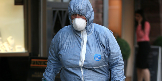 LONDON, ENGLAND - APRIL 07: A police forensics officer enters a Hatton Garden safe deposit centre on April 7, 2015 in London, England. Police are investigating a break in that occured over the Easter weekend. Local reports say that up to 300 deposit boxes may have been targeted. (Photo by Peter Macdiarmid/Getty Images)