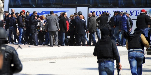 Tourists and visitors line up before being evacuated from the Bardo museum Wednesday, March 18, 2015 in Tunis, after gunmen opened fire at the leading museum in Tunisia's capital. At least 21 people in all were killed, including two gunmen, but some attackers may have escaped, authorities said. (AP Photo/Salah Ben Mahmoud)
