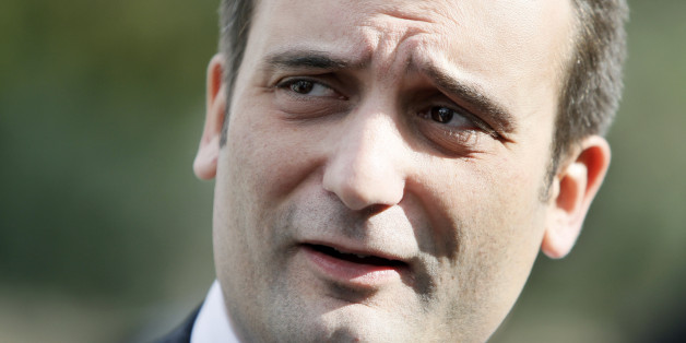 French far right party vice-president and candidate for the March 2014 municipal elections, Florian Philippot, talk to the media after casting his vote for the municipal elections, in Forbach, eastern France, Sunday March 23, 2014. Voters across France are casting ballots in the first round of municipal elections Sunday as two female candidates compete to run Paris City Hall and far right candidates are hoping for a strong showing. (AP Photo/Mathieu Cugnot)