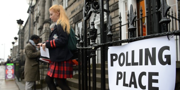 A young voter leaves a polling station after casting her vote in Edinburgh, Scotland, on September 18, 2014, during a referendum on Scotland's independence. Scotland began voting Thursday on whether to become independent, in a referendum that could break up the centuries-old United Kingdom and create Europe's newest country since the collapse of Yugoslavia. AFP PHOTO / LEON NEAL (Photo credit should read LEON NEAL/AFP/Getty Images)