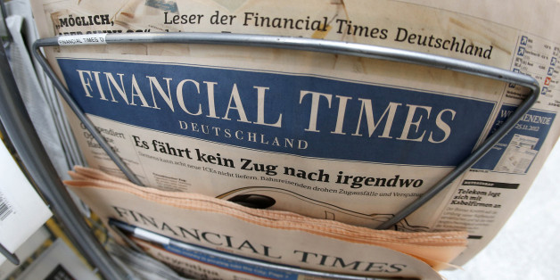 An edition of the Financial Times Deutschland is seen at a newspaper and tobacco shop in Frankfurt, Germany, Friday, Nov. 23, 2012. The publisher of the Financial Times' German offshoot says production will be stopped shortly and some 320 employees will lose their jobs. The Financial Times Deutschland, which has a circulation of about 100,000, was launched at the height of the Internet boom in 2000 but was never profitable. Hamburg-based publisher Gruner + Jahr said in a statement Friday it sees "no way" to continue publishing the loss-making paper beyond Dec. 7 amid further falling advertisement revenues. (AP Photo/Michael Probst)