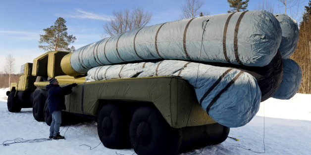 TO GO WITH AFP STORY BY ELISE MENAND An employee of Rusbal private company pumps up an inflatable decoy of the S-300 anti-aircraft missile launcher outside the company workshop in the town of Khotkovo, some 60 km north-east of Moscow, on March 11, 2011. Rusbal developed a range of full-size inflatable decoy armaments, including planes, tanks and missiles to be placed in battlefields to deceive the enemy. AFP PHOTO / ANDREY SMIRNOV (Photo credit should read ANDREY SMIRNOV/AFP/Getty Images)