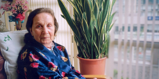 Unable to recognize who is behind the small pocket instamatic, she is only attracted to it by its unfamiliarity. Alzheimer's has taken its toll.