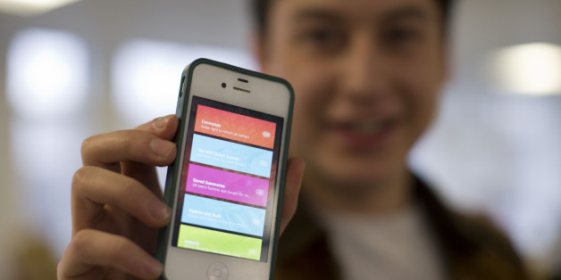Nick d'Aloisio displays his mobile application Summly, as he poses for photographs after being interviewed by the Associated Press in London, Tuesday, March 26, 2013. One of Britain's youngest Internet entrepreneurs has hit the jackpot after selling his top selling mobile application Summly to search giant Yahoo. Seventeen year old Nick d'Aloisio, who dreamed up the idea for the content shortening program when he was studying for his exams, said he was surprised by the deal. As with its other recent acquisitions, Yahoo didn't disclose how much it is paying for Summly, although British newspapers suggested the deal's value at several million dollars. (AP Photo/Matt Dunham)