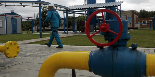 A worker at a boosting compressor station ''East-Poltava'' near the village of Kovalivka, Poltava region some 357 kilometers of Kiev, Ukraine, Friday, June 27, 2014. Russia's state-controlled gas company, Gazprom, warned its European customers Friday that it could limit supplies to those European countries that intend to re-sell the natural gas on to Ukraine. (AP Photo/Sergei Chuzavkov)