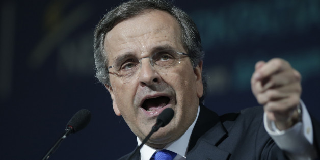 Greece's Prime Minister Antonis Samaras delivers his final campaign speech at the Taekwondo Indoor Stadium in southern Athens on Friday, Jan. 23, 2015. All opinion polls on Sunday's closely-watched national election agree: The radical left opposition Syriza party, which has vowed to rewrite the terms of Greece's international bailout, enjoys a lead of at least 4 percentage points over Prime Minister Antonis Samaras' conservatives. (AP Photo/Lefteris Pitarakis)
