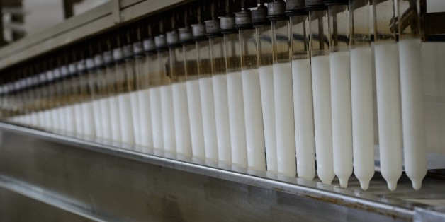 Condoms made with native latex are seen at the Natex factory that produces around 100 million condoms per year for the Brazilian Health Ministry in Xapuri, Acre State on October 7, 2014. Current production equates to a fifth of the 500 millions condoms -- known as 'camisinhas de Venus' or little Venus shirts in Portuguese -- which the government hands out annually free of charge in a country where according to the UNAIDS non-government organization 730,000 people are HIV-positive. AFP PHOTO / YASUYOSHI CHIBA (Photo credit should read YASUYOSHI CHIBA/AFP/Getty Images)