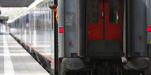 An employee of Deutsche Bahn look out of a train during a train drivers strike at the central station in Munich, Germany, Thursday, April 23, 2015. The GDL union said passenger services will be hit from 2 a.m. (0000 GMT) Wednesday until 9 p.m. (1900 GMT) Thursday. (AP Photo/Matthias Schrader)