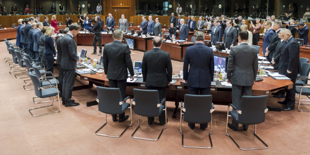 European Union heads of state observe a moment of silence during a round table at an emergency EU summit in Brussels on Thursday, April 23, 2015. EU leaders are facing calls from all sides to take emergency action to save lives in the Mediterranean, where hundreds of migrants are missing and feared drowned in recent days. (AP Photo/Geert Vanden Wijngaert)
