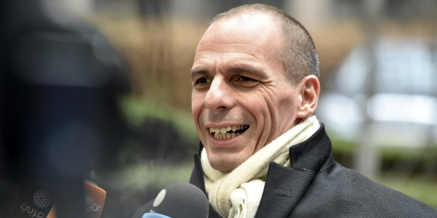 Greek Finance Minister Yanis Varoufakis speaks with the media as he arrives for a meeting of eurogroup finance ministers in Brussels on Friday, Feb. 20, 2015. Eurozone finance ministers meet for a crucial day of talks Friday to see whether a Greek debt relief proposal is acceptable to Germany and other nations using the common currency. (AP Photo/Geert Vanden Wijngaert)