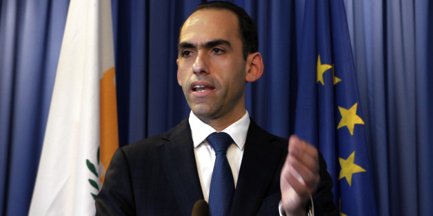 Cyprus' finance minister Harris Georgiades speaks to the media during a press conference at the Ministry of Finance, Nicosia, Cyprus, Thursday, Nov.7, 2013. Cyprus' finance minister says that international creditors' second review of the country's bailout program has found that the required reforms are on track. (AP Photo/Petros Karadjias)
