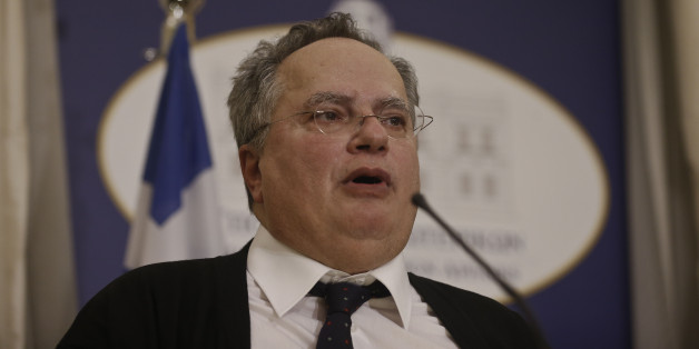 Greece's New Foreign Minister Nikos Kotzias makes statements during a handover ceremony in Athens, Tuesday, Jan. 27, 2015. Greece's new left-wing Prime Minister Alexis Tsipras picked an outspoken bailout critic, Yanis Varoufakis, as his new finance minister Tuesday, signaling his revolve to take a tough line with eurozone lenders in an effort to write off a massive chunk rescue debt. (AP Photo/Petros Giannakouris)