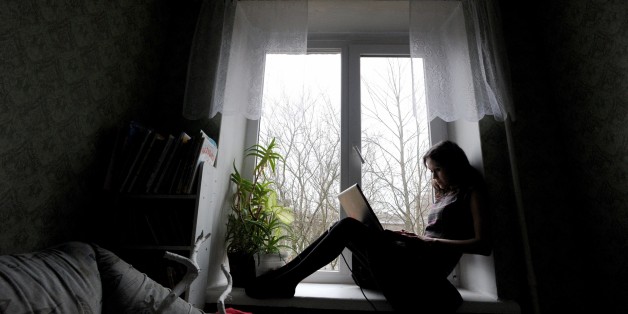 TO GO WITH AFP STORY BY MARINA KORENEVA
Lioudmilla Savtchouk (Ljudmilla Sawtschuk or Ludmilla Sawtschuk or Lyudmila Savchuk or Lyudmila Savchuk) works on her laptop during an interview in Saint Petersburg on March 31, 2015. Lyudmila Savchuk says it was the mony that wooed her into the ranks of the Kremlin's information troops, filling Internet pages with content eulogising Russian President Vladimir Putin while mocking his critics and adversaries. 'Putin is great,' 'Ukrainians are Fascists,' 'Europe is decadent': Savtchouk, a 34-year-old doe-eyed brunette lists the main messages she was instructed to put out on Internet forums after responding to a job advertisement online. AFP PHOTO / OLGA MALTSEVA (Photo credit should read OLGA MALTSEVA/AFP/Getty Images)