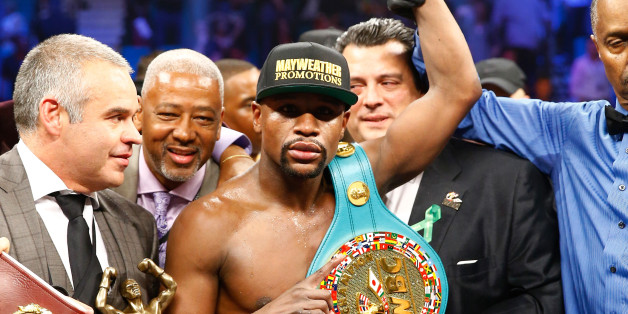 LAS VEGAS, NV - MAY 02: Floyd Mayweather Jr. celebrates the unanimous decision victory during the welterweight unification championship bout on May 2, 2015 at MGM Grand Garden Arena in Las Vegas, Nevada. (Photo by Al Bello/Getty Images)