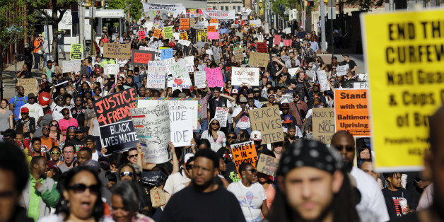 Protesters march through Baltimore on Saturday, May 2, 2015, the day after charges were announced against the police officers involved in Freddie Gray's death. (AP Photo/Patrick Semansky)