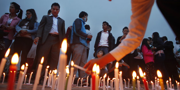 Nepalese participate in a candle light vigil for victims of last week's earthquake in Kathmandu, Nepal, Saturday, May 2, 2015. The magnitude-7.8 earthquake killed thousands of people and the U.N. has estimated the quake affected 8.1 million people, more than a fourth of Nepal's population of 27.8 million. (AP Photo/Niranjan Shrestha)