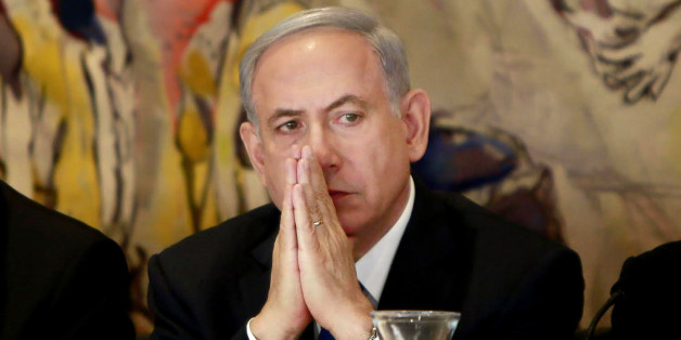 Israel's Prime Minister Benjamin Netanyahu listens during an event following the first session of the newly-elected Knesset in Jerusalem, Tuesday, March 31, 2015. (AP Photo/Gali Tibbon, Pool)