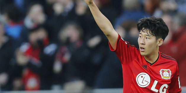 Leverkusen's Son Heung-min from South Korea celebrates scoring his sides third goal during the German first division Bundesliga soccer match between Bayer Leverkusen and VfL Wolfsburg in Leverkusen, Germany, Saturday, Feb. 14, 2015. (AP Photo/Frank Augstein)
