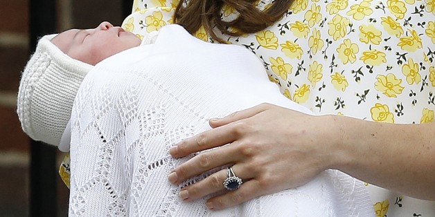 FILE - In this Saturday, May 2, 2015. file photo, Kate Duchess of Cambridge holds her newborn baby princess as they leave The Lindo Wing of St. Mary's Hospital, in London Britain's newborn princess has been named Charlotte Elizabeth Diana it was announced on Monday May 4. (AP Photo/Kirsty Wigglesworth, File)