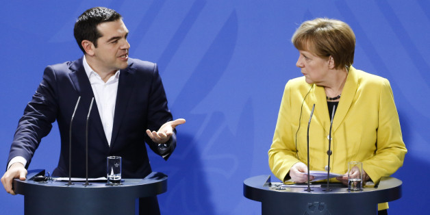 German Chancellor Angela Merkel, right, and the Prime Minister of Greece Alexis Tsipras brief the media during a bilateral meeting at the chancellery in Berlin, Monday, March 23, 2015. (AP Photo/Markus Schreiber)