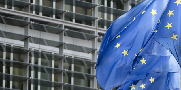 EU flags flap in the wind outside EU headquarters in Brussels on Monday, Feb. 2, 2015. Due to a heightened state of alert, the government has ordered soldiers from the Belgian Army to be stationed outside key institutions in Belgium, including EU headquarters. (AP Photo/Virginia Mayo)