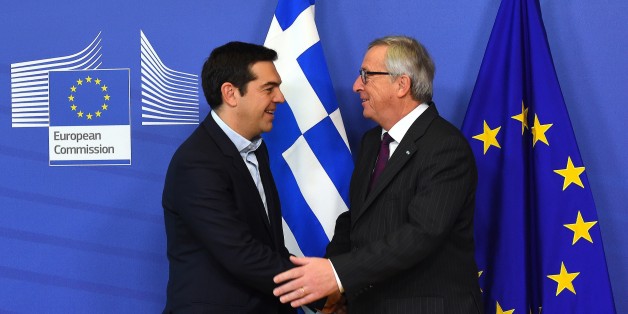 European Commission President Jean-Claude Juncker (R) greets Greek Prime Minister Alexis Tsipras at the European Commission headquarters in Brussels on February 4, 2015. Greek Prime Minister Alexis Tsipras made his first visit to Brussels since coming to power, promising to renegotiate his country's international bailout. AFP PHOTO / EMMANUEL DUNAND (Photo credit should read EMMANUEL DUNAND/AFP/Getty Images)
