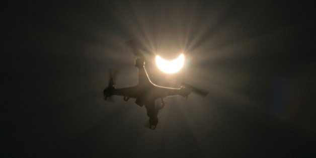 A drone flies in foreground of a partial solar eclipse in Vienna on March 20, 2015. AFP PHOTO / JOE KLAMAR (Photo credit should read JOE KLAMAR/AFP/Getty Images)