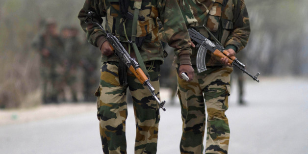 Indian army soldiers arrive at the site of a gunbattle in Srinagar, India, Wednesday, March 13, 2013. Two militants carrying guns and grenades attacked a group of paramilitary soldiers on the outskirts of the capital of Indian-controlled Kashmir on Wednesday morning, leaving five soldiers and both militants dead and 10 other people wounded, police said. It was the bloodiest militant attack in the capital in years. (AP Photo/Dar Yasin)