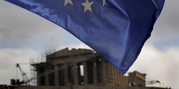 A European Union Flag flies in Athens, on Monday, Jan. 30, 2012 as the ancient Parthenon temple is seen in the background. EU leaders in Brussels Monday are expected to consider the progress of negotiations with Greece for a major debt-relief deal and second bailout loan agreement. (AP Photo/Petros Giannakouris)