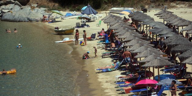 Photo taken on 23 July, 2013, shows a beach in Sikia, in Chalkidiki Peninsula some 650km north of Athens.Overall, international arrivals to Greece increased by 9.5 percent during the January-June 2013 period compared with the same period last year.Based on the above data and in view of the upcoming high summer season, industry professionals remained optimistic that this year's arrivals figures would hit the 17 million mark. AFP PHOTO /Sakis Mitrolidis (Photo credit should read SAKIS MITROLIDIS/AFP/Getty Images)