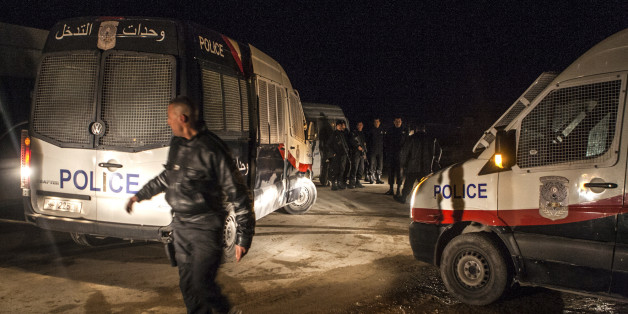 Police forces patrol near a house where suspected Islamist militants were hidden in Raoued, near Tunis, Monday night Feb. 3, 2014. Tunisia's police exchanged gunfire with a group of suspected Islamic militants holed up in a house in a suburb near the capital on Tuesday, leaving two militants and a policeman dead, an Interior Ministry spokesman said Tuesday Feb. 4, 2014. (AP Photo/Aimen Zine)