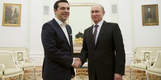 Russian President Vladimir Putin, right, welcomes visiting Greek Prime Minister Alexis Tsipras in Moscow's Kremlin, Russia, Wednesday, April 8, 2015. Alexis Tsipras is in Russia on an official visit. (AP Photo/Alexander Zemlianichenko, Pool)