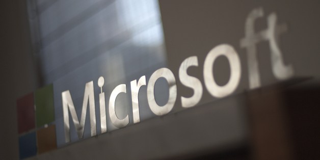 The Microsoft logo is seen before the start of a media event in San Francisco, California on Thursday, March 27, 2014. Satya Nadella, CEO of Microsoft, unveiled a version of Office designed for the iPad today. Microsoft is tapping into its software past as it maps its future in the rapidly changing world of Internet technology. AFP PHOTO/JOSH EDELSON (Photo credit should read Josh Edelson/AFP/Getty Images)