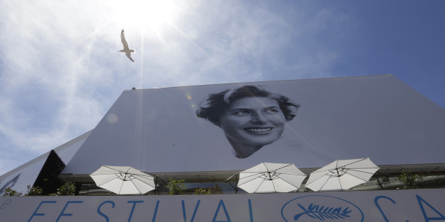 A bird flies past the official banner depicting actress Ingrid Bergman outside the Palais des Festivals ahead of the 68th international film festival, Cannes, southern France, Tuesday, May 12, 2015. The festival opens on Wednesday, May 13 and runs until Sunday, May 24. (AP Photo/Lionel Cironneau)