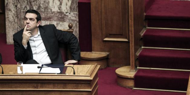 Greek Prime Minister Alexis Tsipras waits to greet the CEO of Russian gas giant Gazprom prior to their meeting in Athens on April 21, 2015. Gazprom CEO Alexei Miller arrived in Athens to discuss energy issues, after reports that the two parties are set to sign a pipeline deal in which Russia would make billions in an advance payment to cash-strapped Greece. AFP PHOTO / LOUISA GOULIAMKI (Photo credit should read LOUISA GOULIAMAKI/AFP/Getty Images)