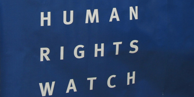 Phil Robertson, left, deputy director of Human Rights Watch's Asia division, and the group's Asia researcher in the women's rights division Aruna Kashyap attend a press conference in Phnom Penh, Cambodia Thursday, March 12, 2015. Leading clothing retailers such as Gap and H&M need to help alleviate labor abuses at factories in Cambodia that manufacture their products, the New York-based human rights organization said, Thursday, March 12, 2015. (AP Photo/Heng Sinith)
