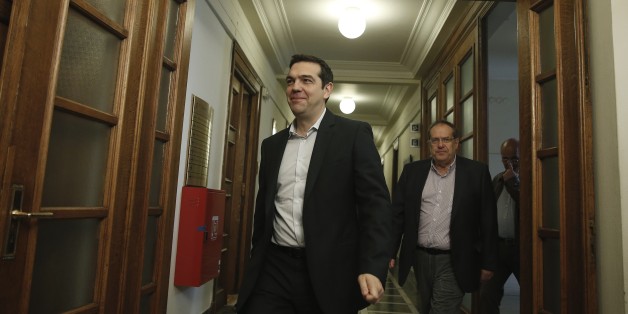 Greek Prime Minister Alexis Tsipras arrives at a cabinet meeting in central Athens, on Tuesday, May 12, 2015. Officials say Greece has completed a 757 million euro ($844 million) debt payment to the International Monetary Fund, despite an acute cash shortage that could come to a head within the next two weeks. (AP Photo/Petros Giannakouris)
