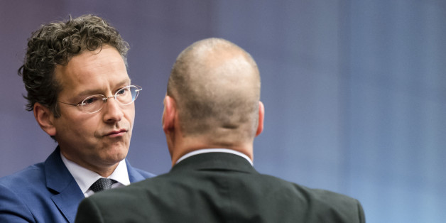 Dutch Finance Minister Jeroen Dijsselbloem, left, speaks with Greek Finance Minister Yanis Varoufakis during a round table meeting of the eurogroup finance ministers at the EU Council building in Brussels on Monday, May 11, 2015. Hopes for a deal between Greece and its European creditors at a key meeting Monday are slim, weighing on the region's stock markets as the country struggles to make upcoming debt repayments. (AP Photo/Geert Vanden Wijngaert)