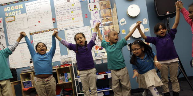 In this April 13, 2011 photo, children take part in a music class at the Mott Haven Academy Charter School, in the Bronx borough of New York. The school is trying to chart a course for others nationwide with a program designed to give foster children better odds at a good future. The school is sponsored by a citywide private child welfare agency, the New York Foundling. Foundling Executive Director Bill Baccaglini says the Foundlingâs Bronx Community Services shares the building with the school. Thus, there are always more than 200 counselors on call to help students individually. (AP Photo/Mary Altaffer)
